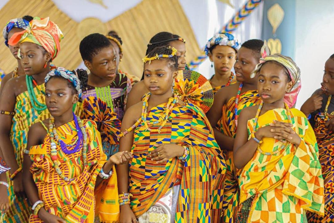 Ghanaian people wearing colourful kente cloth
